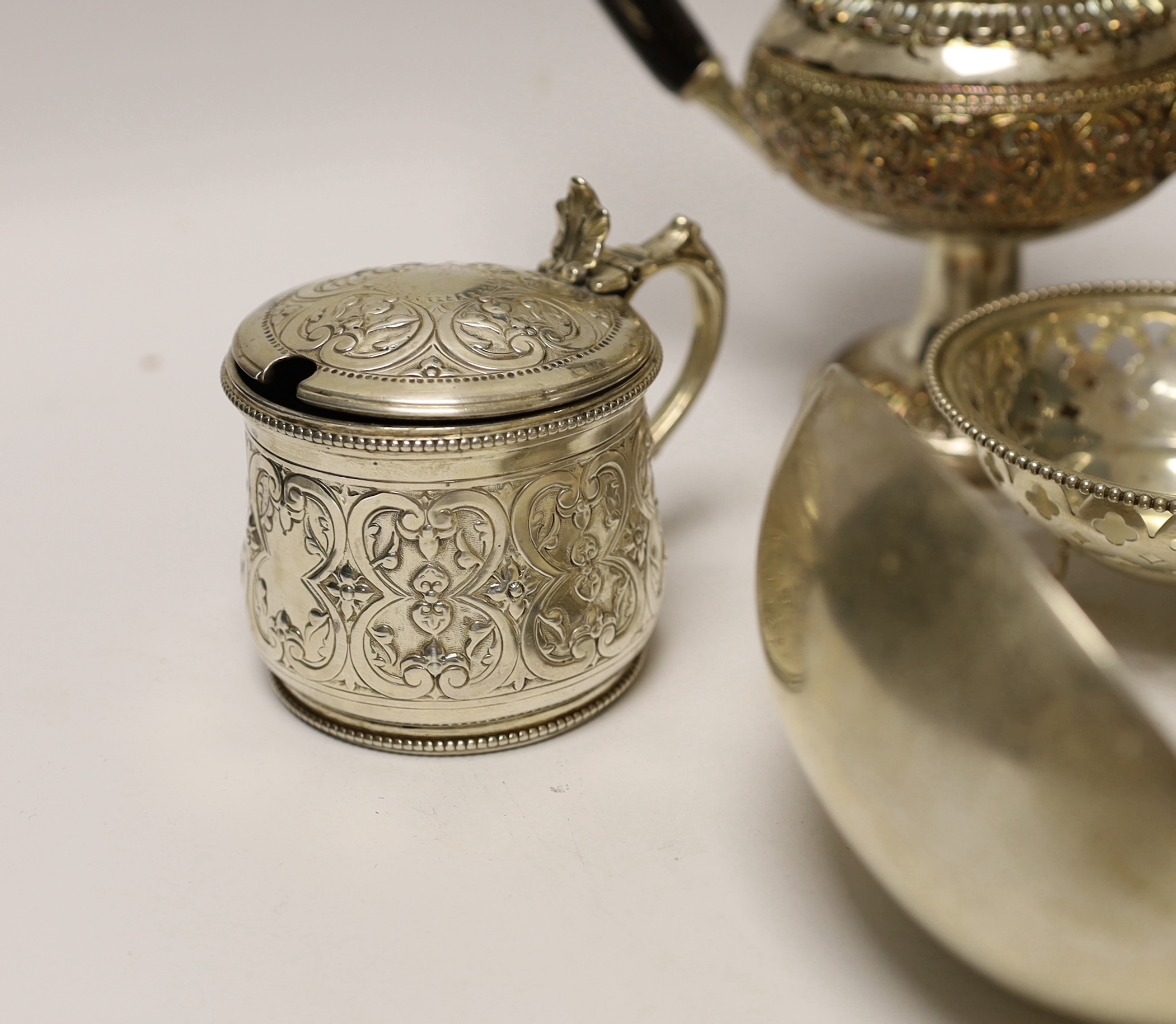 A quantity of silver and white metal items including a continental filigree basket, small silver bonbon dish, George III soup ladle, salts, Victorian silver mustard, etc.